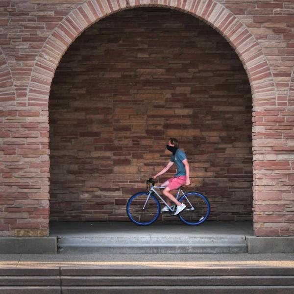 A student rides his bike near the UMC during the first week of classes at CU Boulder. (Photo by Casey A. Cass/University of Colorado)