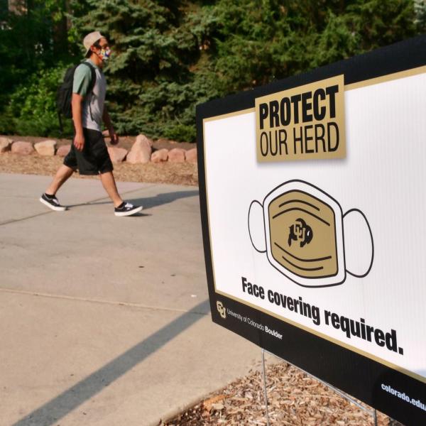 A student walks near the UMC during the first week of classes in the midst of the COVID-19 pandemic at CU Boulder. (Photo by Casey A. Cass/University of Colorado)