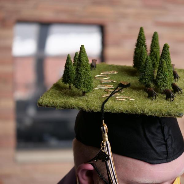 Aric McCarty sports a creatively decorated cap during CU Boulder’s Graduate Appreciation Days events. (Photo by Glenn Asakawa/University of Colorado)