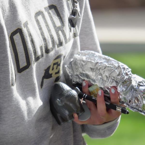 Graduating students enjoy free burritos from Cafe Mexicali as part of Grad Appreciation Days.