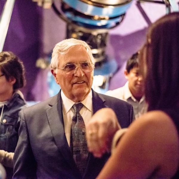 Apollo Astronaut Harrison "Jack" Schmitt converses with audience members at the Fiske Planetarium VIP event. Photo by Patrick Wine.