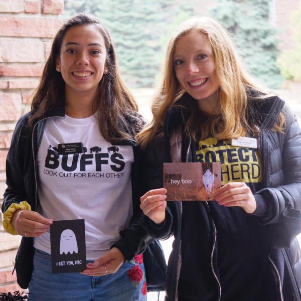Students show off wellness T-shirts and Halloween-themed cards at the Health Hut event during the 2021 Health and Wellness Summit on the CU Boulder campus. (Photo by Glenn Asakawa/University of Colorado)