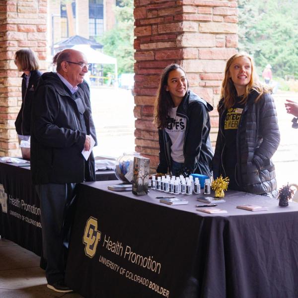 Chancellor Phil DiStefano talks with students at the Health Hut event during the 2021 Health and Wellness Summit on the CU Boulder campus. (Photo by Glenn Asakawa/University of Colorado)