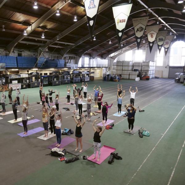 Homecoming yoga session at Balch Fieldhouse