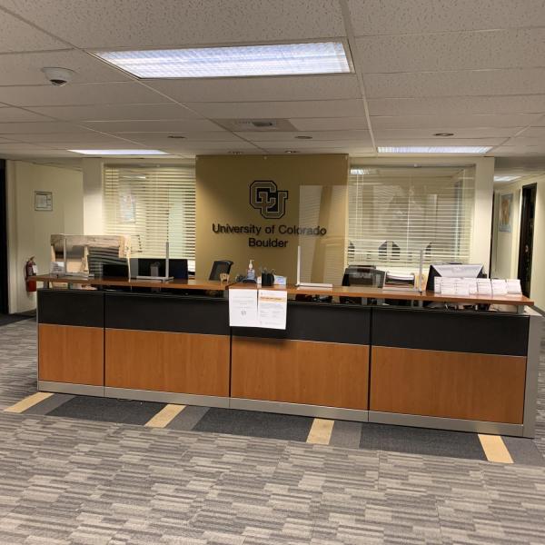 Protective measures, such as Plexiglas, are installed at customer service points on campus.