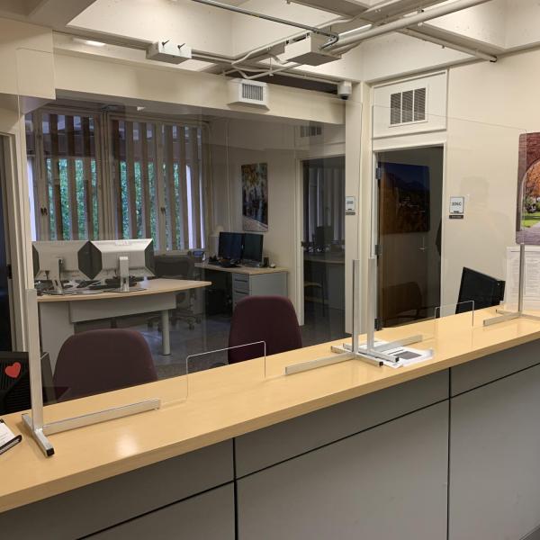Protective measures, such as Plexiglas, are installed at customer service points on campus.
