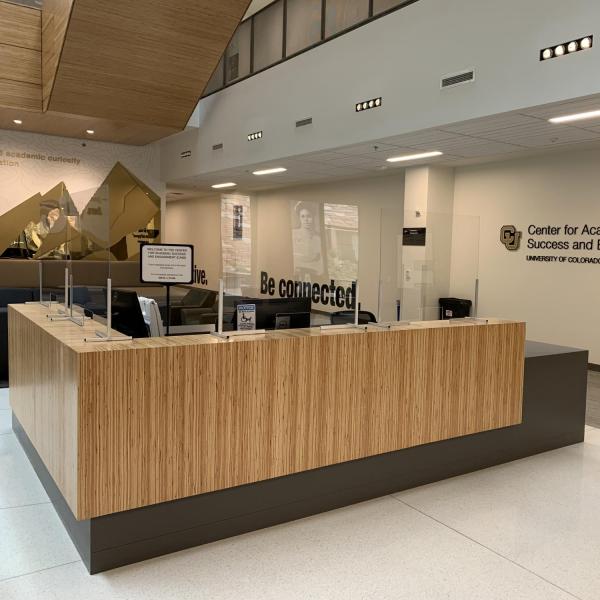 Protective measures, such as Plexiglas, are installed at customer service points on campus.