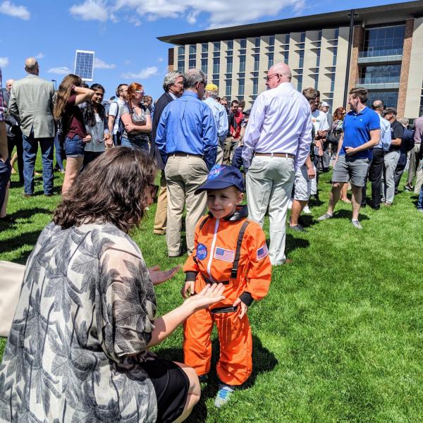 A future astronaut enjoys the ribbon-cutting ceremony for the new Aerospace Engineering Sciences Building at CU Boulder. (Photo by Casey A. Cass/CU Boulder)