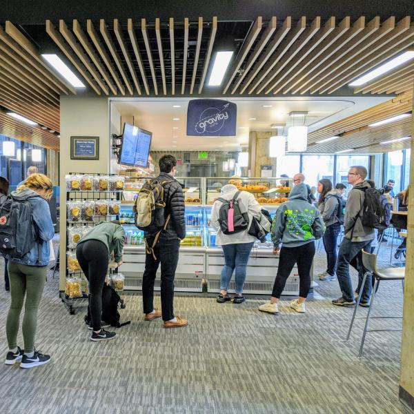 Lining up for coffee at the Gravity Cafe in the Engineering Center. (Photo by Glenn Asakawa /University of Colorado)