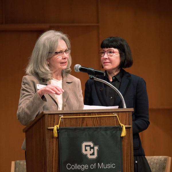Rebecca Roser, chair of the Music + advancement campaign, left, and Michele Ritter, chair of the College of Music Advisory Board, speak during the groundbreaking ceremony. Photo by Glenn Asakawa.
