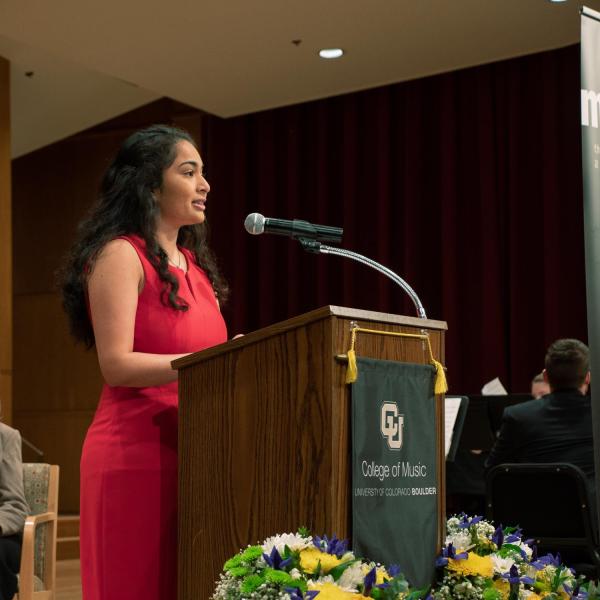 Anoushka Divekar, president of the College of Music Student Government, speaks in Grusin Hall during the groundbreaking ceremony. Photo by Glenn Asakawa.