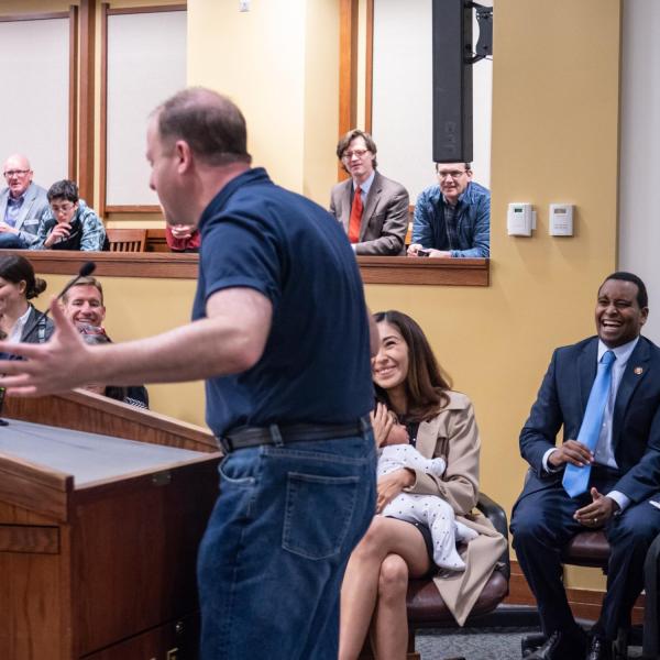 Gov. Jared Polis speaks before a ceremonial swearing-in event for U.S. Representative Joe Neguse. Photo by Glenn Asakawa.