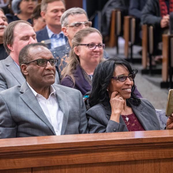 Debesai and Azeib Neguse proudly listen to their son U.S. Representative Joe Neguse, following a swearing-in event. Photo by Glenn Asakawa.