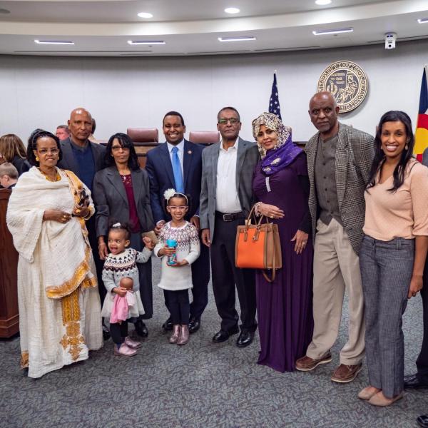 Family gather for a portrait following a ceremonial swearing-in event for U.S. Representative Joe Neguse. Photo by Glenn Asakawa.