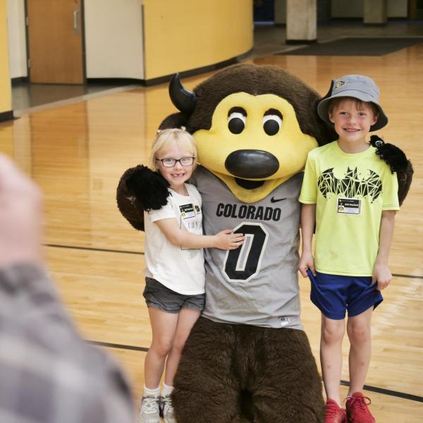 Fans take a photo with Chip at Campus Kids Day. (Photo by Casey A. Cass/University of Colorado)