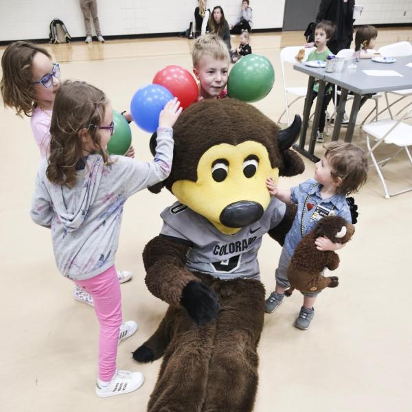 Kids have fun with Chip at Campus Kids Day. (Photo by Casey A. Cass/University of Colorado)