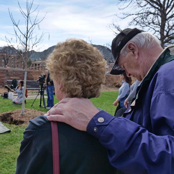Tom and Margie Whittington, the parents of shooting victim Teri Leiker, embrace during the dedication ceremony.