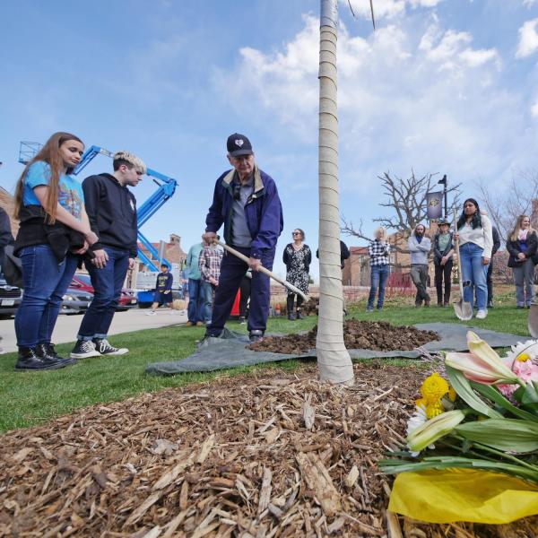 Tom Whittington, the father of shooting victim Teri Leiker, submits an offering during the dedication ceremony.
