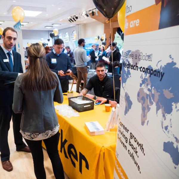 Students talk with perspective employers during the Leeds career fair. Photo by Patrick Campbell.