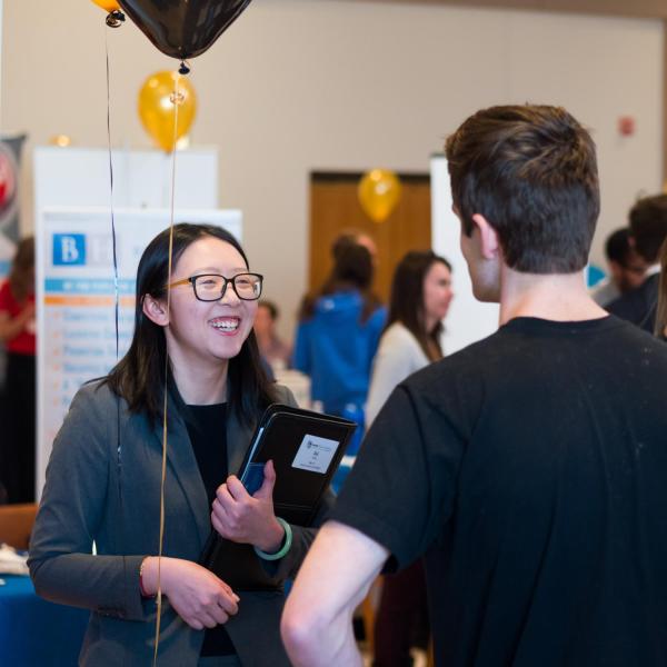 Students talk with perspective employers during the Leeds career fair. Photo by Patrick Campbell.