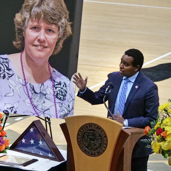 Rep. Joe Neguse (D-Boulder) speaks at Teri Leiker’s memorial service April 9, 2021, at the CU Events Center. (Casey Cass/CU Boulder)