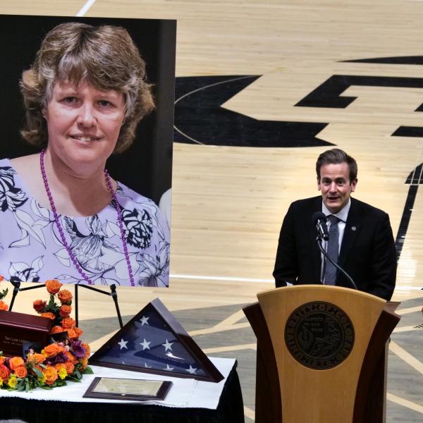 Matthew Dockendorf, director of CU Boulder’s Golden Buffaloes Marching Band, speaks at Teri Leiker’s memorial service April 9, 2021, at the CU Events Center. (Casey Cass/CU Boulder)