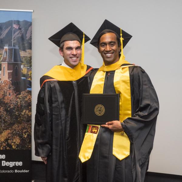 Members of the first graduating class of the Masters of the Environment receive their diplomas at the recognition ceremony