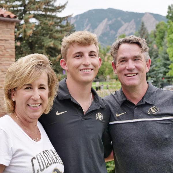CU Boulder Chief Operating Officer Pat O’Rourke, with the help of his wife, Robin, helps his son, Ryan, during move-in