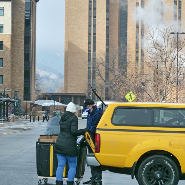 A student moves their belongings during Move-In Day on Feb. 8, 2021, at Williams Village at CU Boulder. (Photo by Casey A. Cass/University of Colorado)