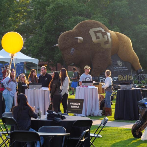 Graduates from the class of 2020 and 2021 gather for a celebratory evening at the Night on Norlin event on Sept. 17, 2021. (Photo by Glenn Asakawa/University of Colorado)