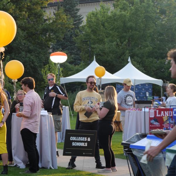 Graduates from the class of 2020 and 2021 gather for a celebratory evening at the Night on Norlin event on Sept. 17, 2021. (Photo by Glenn Asakawa/University of Colorado)
