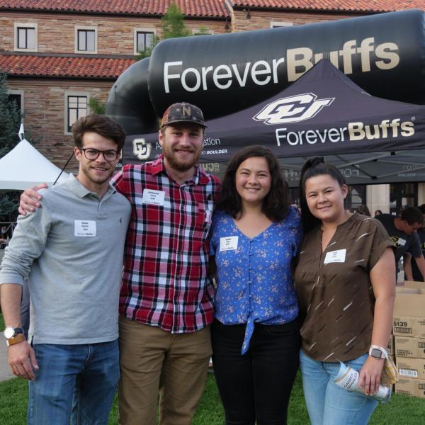 Graduates from the class of 2020 and 2021 gather for a celebratory evening at the Night on Norlin event on Sept. 17, 2021. (Photo by Glenn Asakawa/University of Colorado)