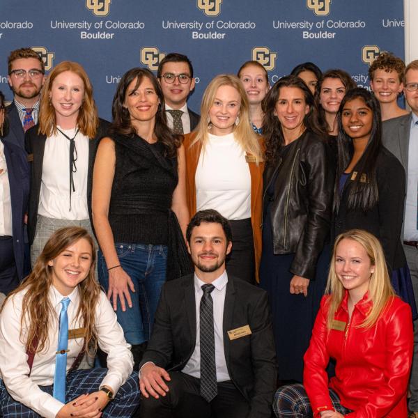 NYT reporters Megan Twohey, left, and Jodi Kantor, right, pose with members of the Distinguished Speakers Board on Monday, Oct. 21. (Photo by Patrick Wine/University of Colorado)