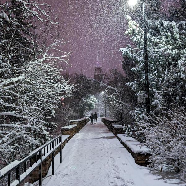 Evening snow over Varsity Bridge, with Old Main in the distance