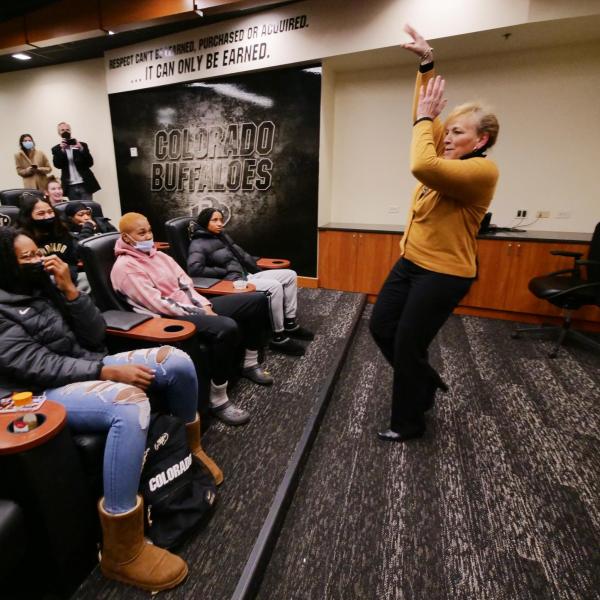 Angie Paccione speaks to members of the women’s basketball team during her visit