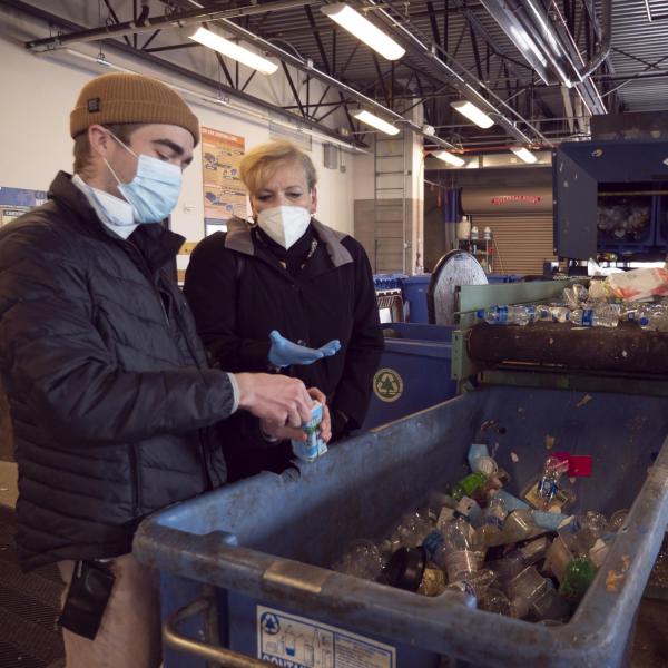 Robin Poley, Zero Waste program assistant, visits with Angie Paccione during a sustainability tour at CU Boulder