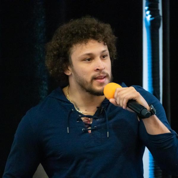 Phillip Lindsay speaks during the 2020 Inclusive Sports Summit morning keynote address at CU Boulder. (Photo by Patrick Wine/University of Colorado)