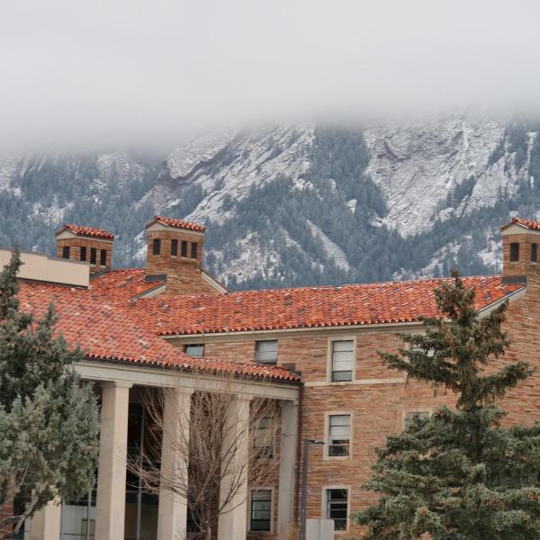 Snow-dusted Flatirons and Libby residence hall. Photo by Casey A. Cass.