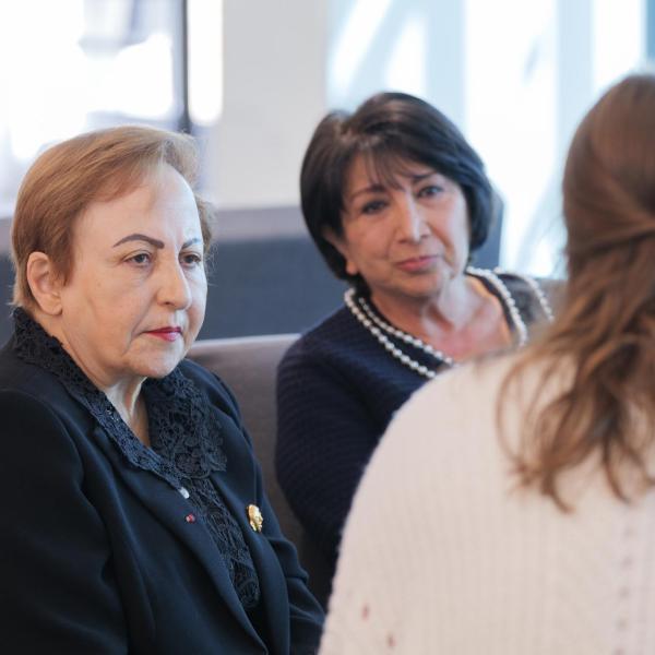 Shirin Ebadi, left, is interviewed by Daily Camera reporter Olivia Dock, right. (Photo by Glenn J. Asakawa/University of Colorado)