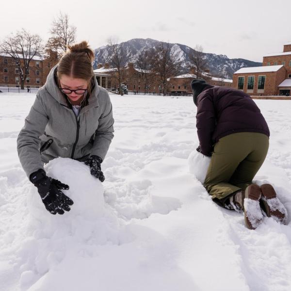 CU Boulder students play in the snow on the campus January 27, 2022. (Photo by Glenn Asakawa/University of Colorado)
