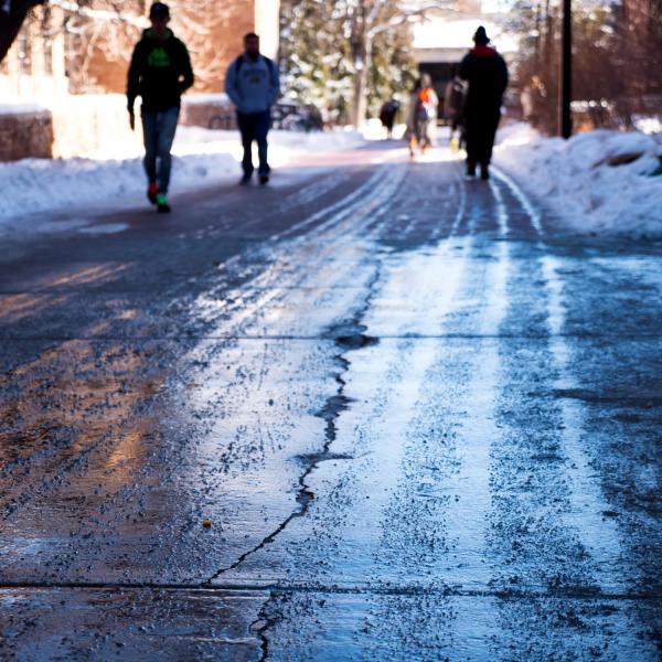 Students walking after a weekend snowstorm blanketed the campus with several inches of fresh snow. Photo by Patrick Campbell.
