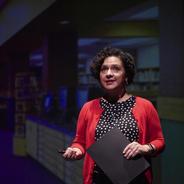 Manuela Sifuentes, CU Engage director of community partnerships, speaks to the crowd during the School of Education's Ed Talks, held at the Dairy Arts Center. Photo by Patrick Campbell.