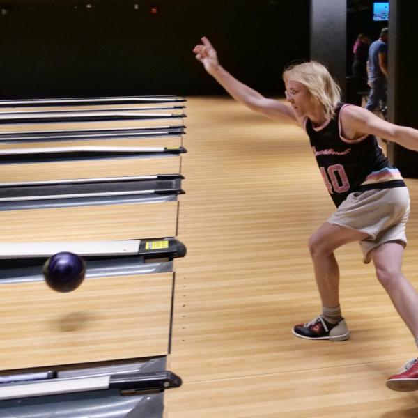 Strategic Resources and Support employees enjoy bowling at an appreciation event in The Connection