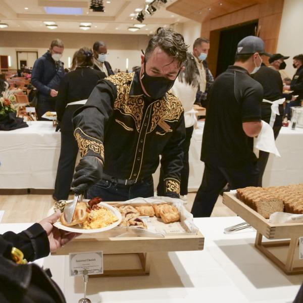 Chief Operating Officer Patrick O’Roarke serves up some breakfast at the Staff Appreciation Breakfast. Photo by Casey A. Cass.