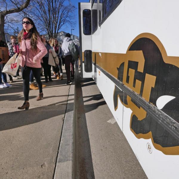 People step off the Buff Bus on the first day back from winter break. Photo by Casey A. Cass.