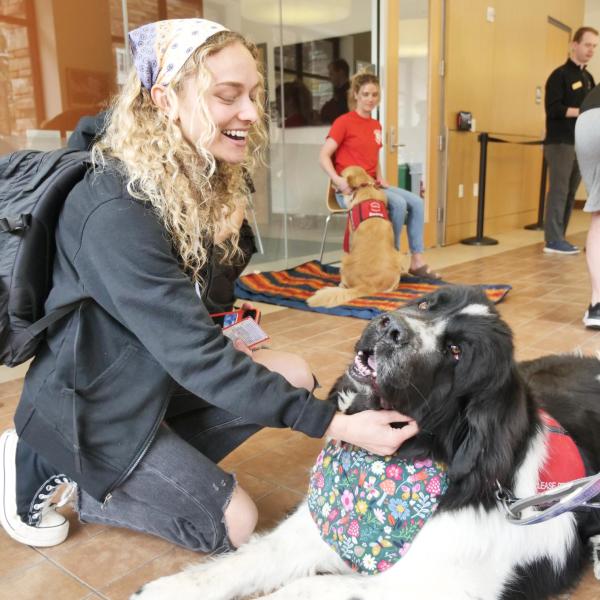 Junior Maggie Cornelius befriends therapy dog Banksy