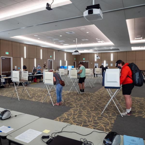 Students cast their ballots at a polling place in the Williams Village Center at CU Boulder. (Photo by Patrick Campbell/University of Colorado)