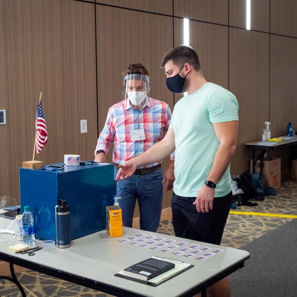Students cast their ballots at a polling place in the Williams Village Center at CU Boulder. (Photo by Patrick Campbell/University of Colorado)