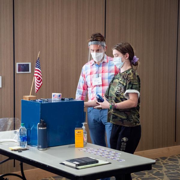 Students cast their ballots at a polling place in the Williams Village Center at CU Boulder. (Photo by Patrick Campbell/University of Colorado)