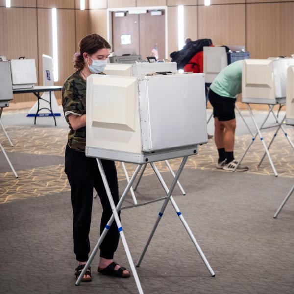 Students cast their ballots at a polling place in the Williams Village Center at CU Boulder. (Photo by Patrick Campbell/University of Colorado)